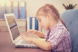 kid using laptop at home